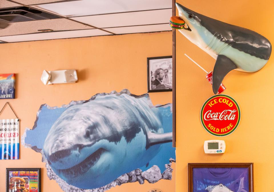 Shark items are a big part of the decor at Jaws Jumbo Burgers, which opens July 10 in Ocala.