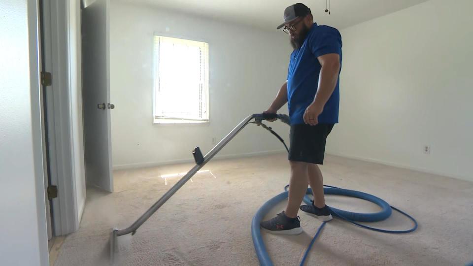 Nick Folmar started his own carpet-cleaning business after being furloughed during the COVID-19 pandemic. / Credit: CBS News