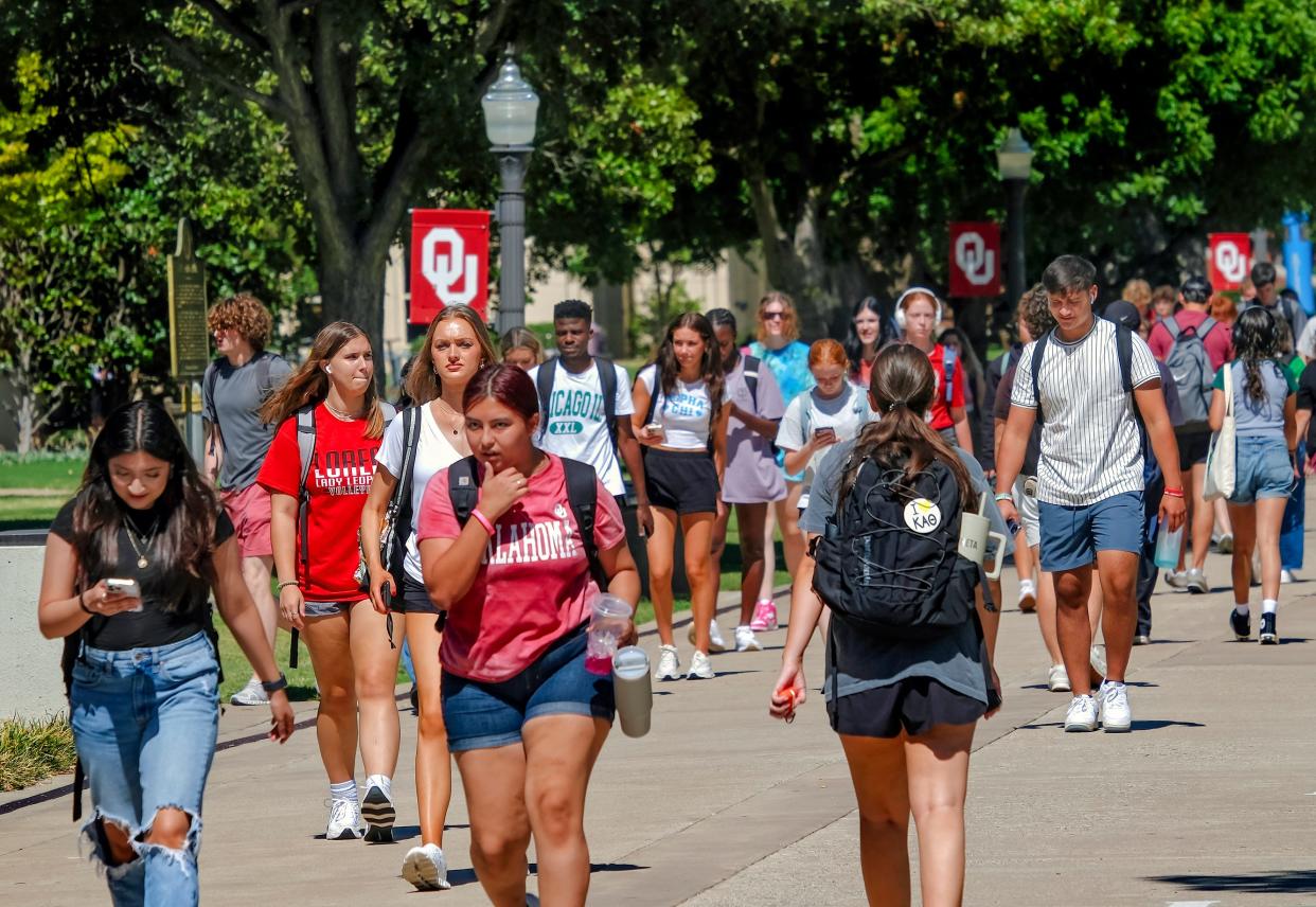 Students walk on the South Oval of the University of Oklahoma campus. Gov. Kevin Stitt signed an executive order requiring state agencies and institutions of higher education in Oklahoma to initiate a review of DEI positions, departments, activities, procedures and programs to “eliminate and dismiss” what the order called “non-critical personnel.”