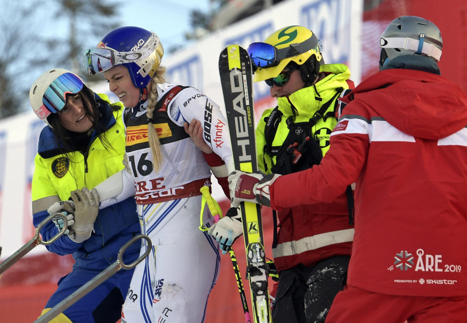 FILE - In this Tuesday, Feb. 5, 2019 file photo United States' Lindsey Vonn is assisted after crashing during the women's super G at the alpine ski World Championships, in Are, Sweden. (Pontus Lundahl/TT via AP, File)