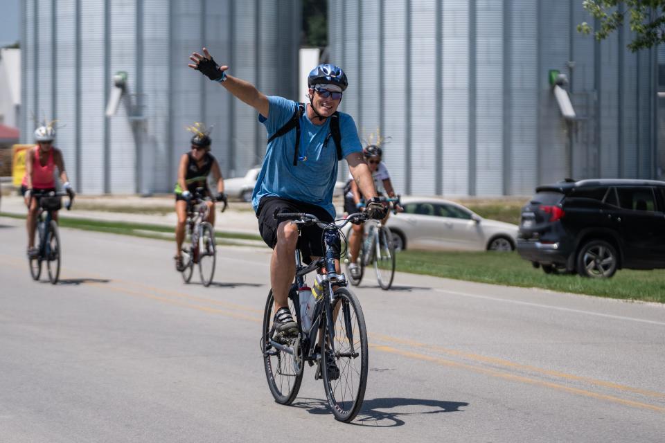 RAGBRAI riders make their way through Breda on their way to Carroll on Day 2 of the 50th anniversary of the ride Monday.