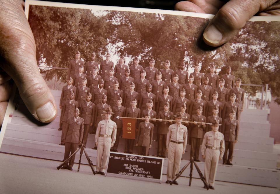 Michael Fleming holds a photo of his 1974 Marine Corps boot camp graduating class at Parris Island, S.C. Fleming, who now works with veterans, is one of three Northeast Florida residents being inducted into the Florida Veterans Hall of Fame.