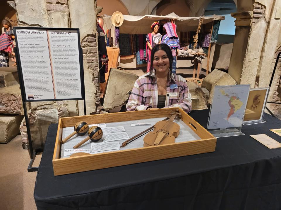 Melanie Martinez, an educator at the Milwaukee Public Museum, presents a display about Latino music and musical instruments.
