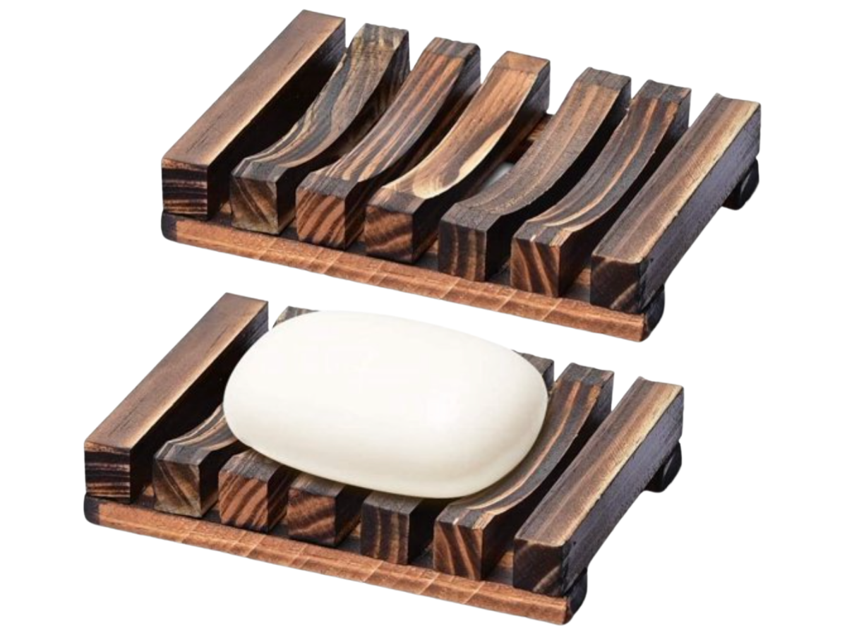 Two wooden soap dishes with a bar of soap