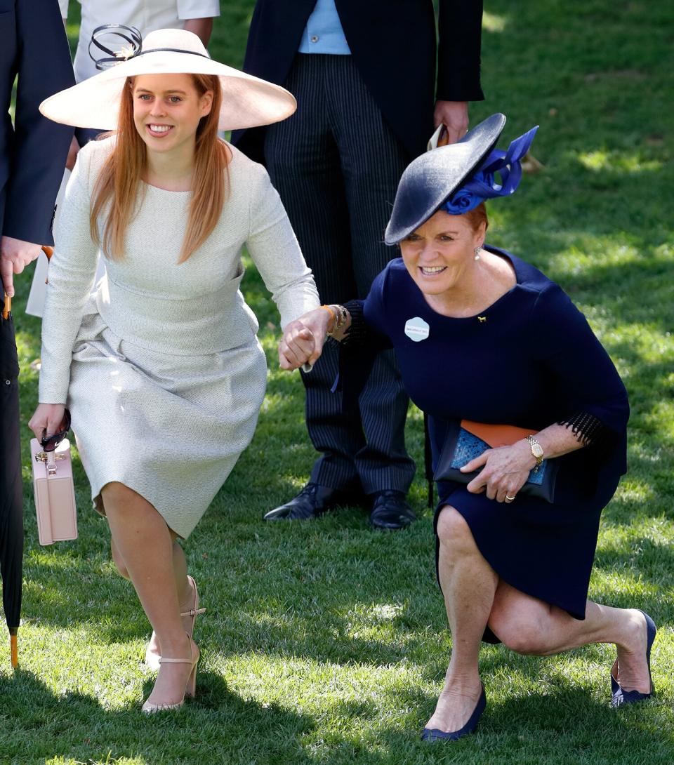Princess Beatrice and Sarah Ferguson make sure to show their respect for the monarch with deep curtsies — with Fergie going the extra mile (or in this case, foot!).