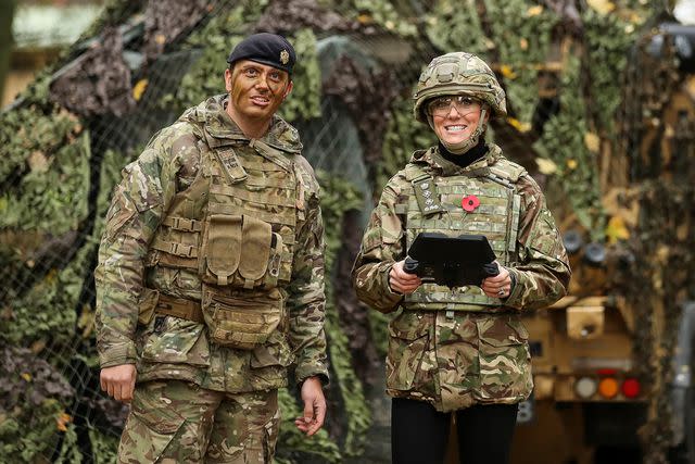 <p>Chris Radburn - WPA Pool/Getty Images</p> Kate Middleton flies a drone visiting the Queen's Dragoon Guards on Nov. 8, 2023