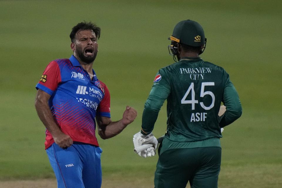 Afghanistan's Fareed Ahmad, left, and Pakistan's Asif Ali, right, react after Ali was dismissed by Ahmad during the T20 cricket match of Asia Cup between Pakistan and Afghanistan, in Sharjah, United Arab Emirates, Wednesday, Sept. 7, 2022. (AP Photo/Anjum Naveed)