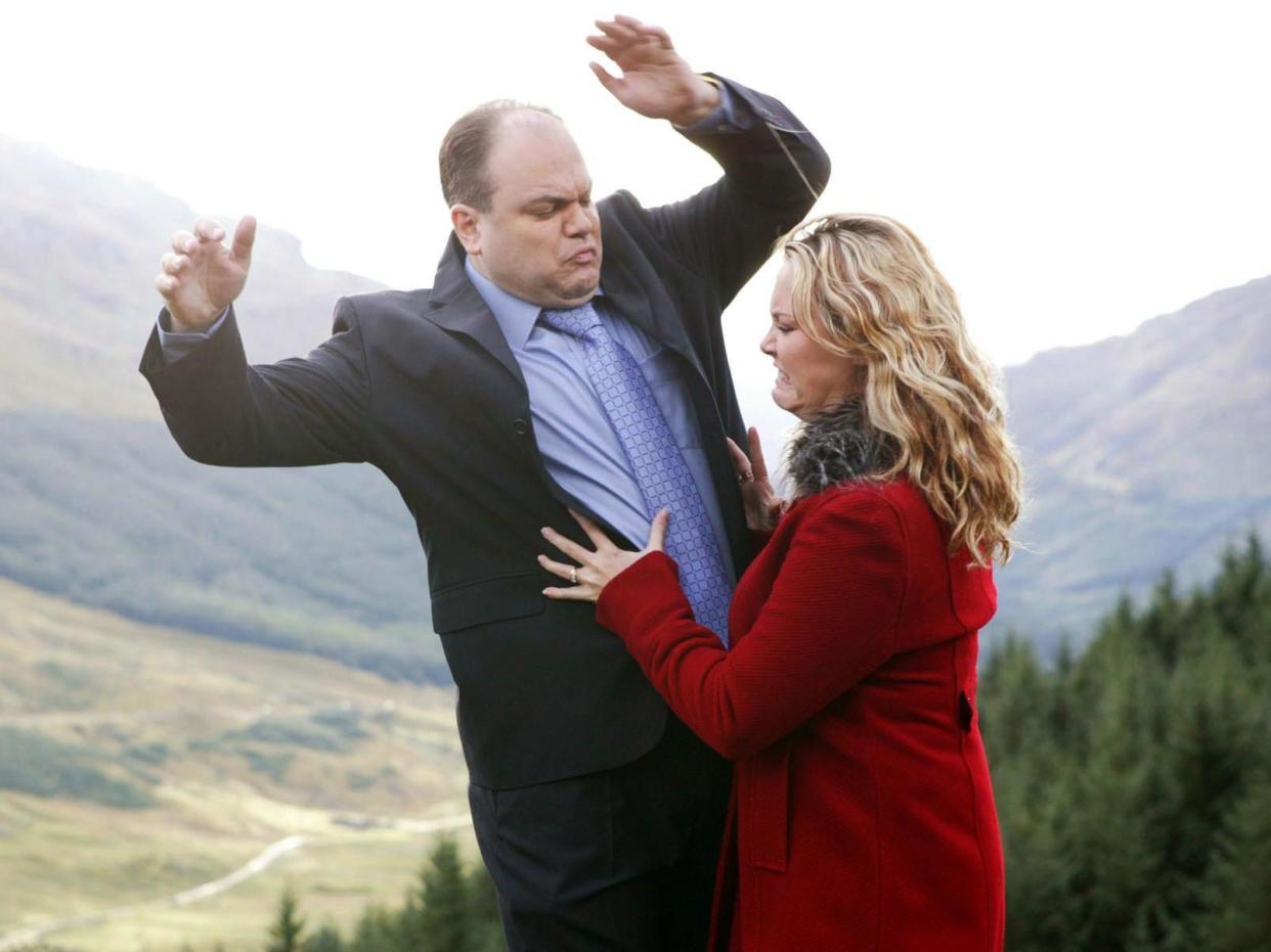 Down he goes: Barry (Shaun Williamson) is pushed off a cliff by his new bride Janine (Charlie Brooks) in a memorable 2003 episode of EastEnders: BBC