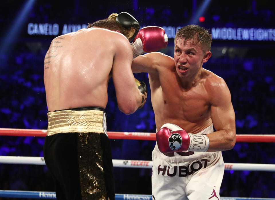 Gennady Golovkin (R), firing a right last September at Canelo Alvarez, signed with online streaming service DAZN on Friday, setting up a potential third bout with his Mexican rival later in the year. (Getty Images)