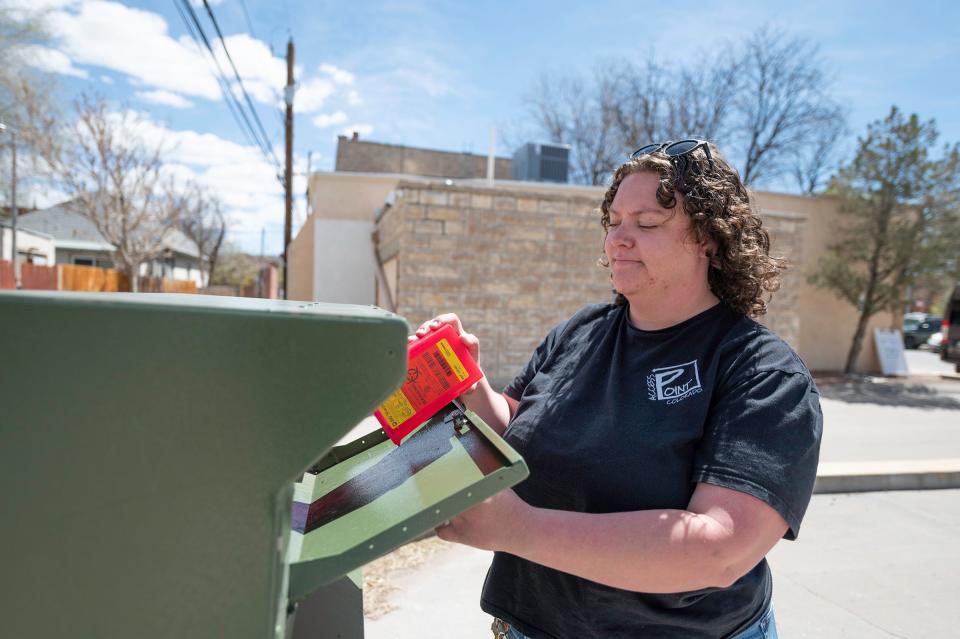Christine Charron, prevention services manager for Access Point Pueblo, disposes used needles into one of the 24/7 sharps disposal bins used by the non-profit on Tuesday, April 16, 2024.