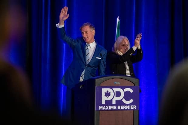 People's Party of Canada Leader Maxime Bernier and wife, Catherine Letarte, speak to supporters at the PPC election night event in Saskatoon on Monday. (Liam Richards/The Canadian Press - image credit)