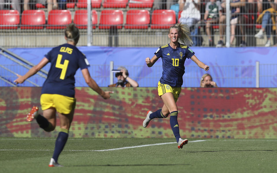 Sweden's Sofia Jakobsson, right, celebrates with teammate Hanna Glas after scoring her side's first goal during the of the Women's World Cup quarterfinal soccer match between Germany and Sweden at Roazhon Park in Rennes, France, Saturday, June 29, 2019. (AP Photo/David Vincent)