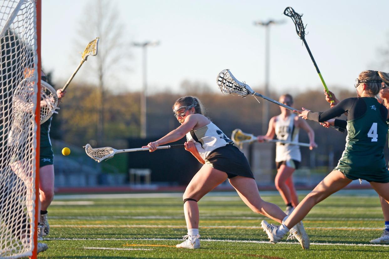 North Kingstown's Jordan Parris fires a shot from in close during Friday's match against Chariho. Parris finished with eight goals in the game.