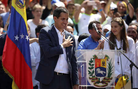 FILE PHOTO: Venezuelan opposition leader and self-proclaimed interim president Juan Guaido reacts during a rally against Venezuelan President Nicolas Maduro's government in Caracas, Venezuela February 2, 2019. REUTERS/Andres Martinez Casares/File Photo