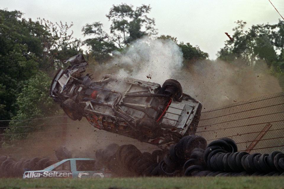 The Pontiac of J.D. McDuffie flips over and crashes on top of Jimmy Means car, bottom, during the sixth lap of the Budweiser at the Glen NASCAR race in Watkins Glen, N.Y.  Driver McDuffie, a NASCAR veteran, died in this accident in Turn No. 5 on August 11, 1991. (AP Photo/Mike Okoniewski)