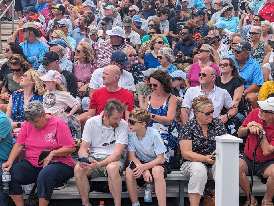 The crowd at Kennedy Space Center's Apollo/Saturn V Center wait for the Delta IV farewell. Front and center are Michael Gratz and his son William Gratz.