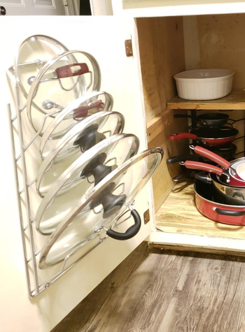 a reviewer uses the organizer for pot lids 