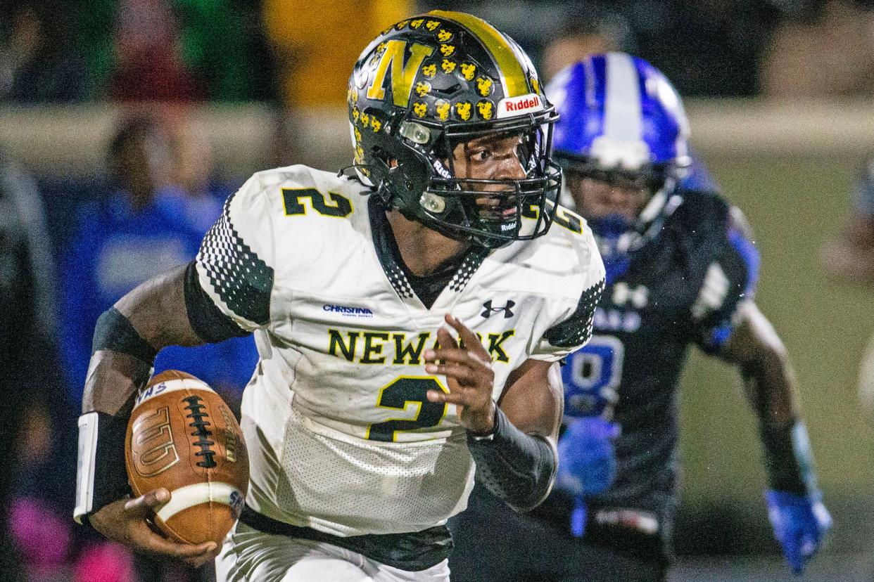 Newark quarterback Makeevis Rogers runs against Howard last week. All three of our experts are picking Caravel to top Newark on Saturday.