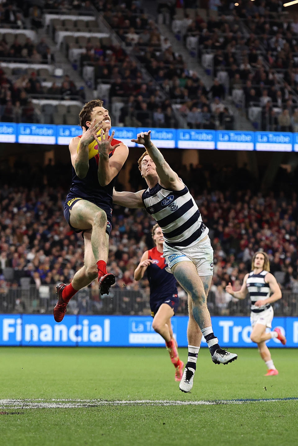 Jake Lever marks the ball against Gary Rohan of the Cats during the AFL First Preliminary Final match.