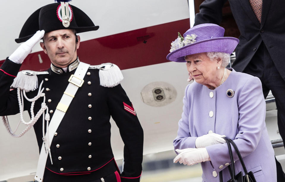 Queen Elizabeth II arrives at Rome's Ciampino military airport to start a one-day visit to Italy and the Vatican, Thursday, April 3, 2014. The British Royals will meet Italian President Giorgio Napolitano during an official lunch at the Quirinale Presidential Palace and Pope Francis at the Vatican in the afternoon. (AP Photo/Angelo Carconi, pool)