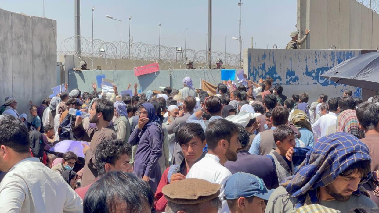 Afghan people who want to leave the country continue to wait around Hamid Karzai International Airport in Kabul, Afghanistan on August 26, 2021. (Haroon Sabawoon/Anadolu Agency via Getty Images)