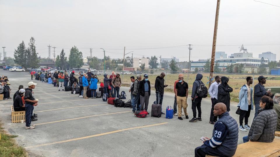 People without vehicles lineup to register for a flight to Calgary, Alberta in Yellowknife on Thursday, Aug. 17, 2023.