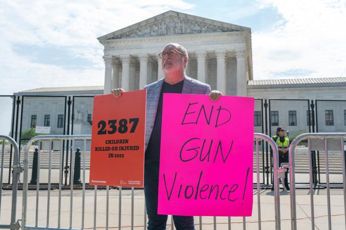 The Rev. Patrick Mahoney protests gun violence June 8 outside the Supreme Court in Washington.