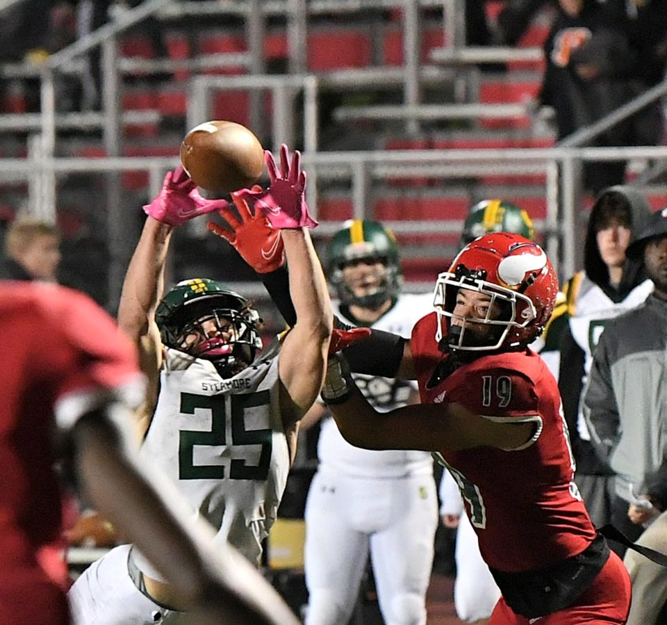 Eugene Harney (25) of Sycamore picks off a pass intended for Princeton's Landen Miree (19), Oct. 20, 2023.