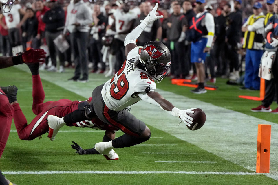 Tampa Bay Buccaneers running back Rachaad White (29) dives in for a touchdown against the Arizona Cardinals during the second half of an NFL football game, Sunday, Dec. 25, 2022, in Glendale, Ariz. (AP Photo/Rick Scuteri)