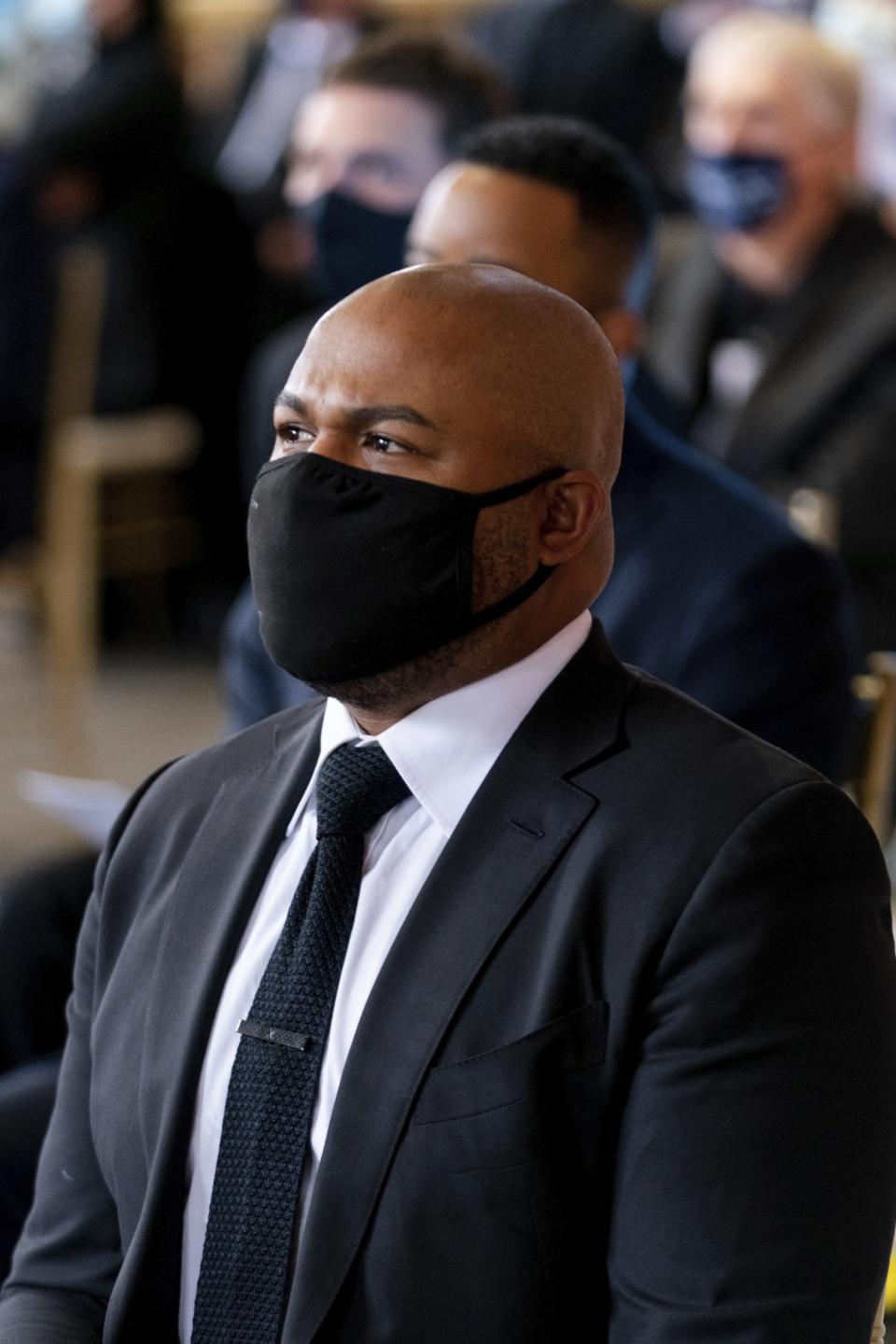 Former Atlanta Braves player Andruw Jones listens during "A Celebration of Henry Louis Aaron," a memorial service celebrating the life and enduring legacy of the late Hall of Famer and American icon, on Tuesday, Jan. 26, 2021, at Truist Park in Atlanta. (Kevin D. Liles/Atlanta Braves via AP, Pool)