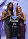 LSU's Angel Reese, left, poses for a photo with WNBA commissioner Cathy Engelbert after being selected seventh overall by the Chicago Sky during the first round of the WNBA basketball draft on Monday, April 15, 2024, in New York. (AP Photo/Adam Hunger)
