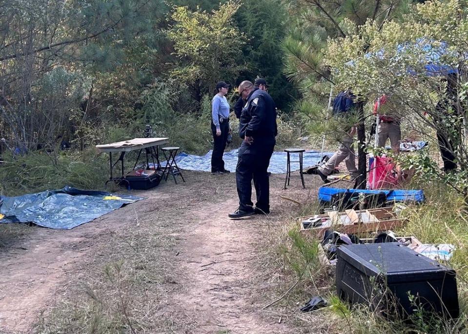 Fayetteville Police Department officers investigating the crime scene where skeletal remains were found in the 3900 block of Bragg Boulevard, Oct. 17, 2023.