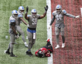 Detroit Lions linebacker Jamie Collins (58) signals "touchdown" as Atlanta Falcons running back Todd Gurley tries to stop short of the end zone to control the final minutes of the clock in the fourth quarter of an NFL football game Sunday, Oct. 25, 2020, in Atlanta. (Curtis Compton/Atlanta Journal-Constitution via AP)