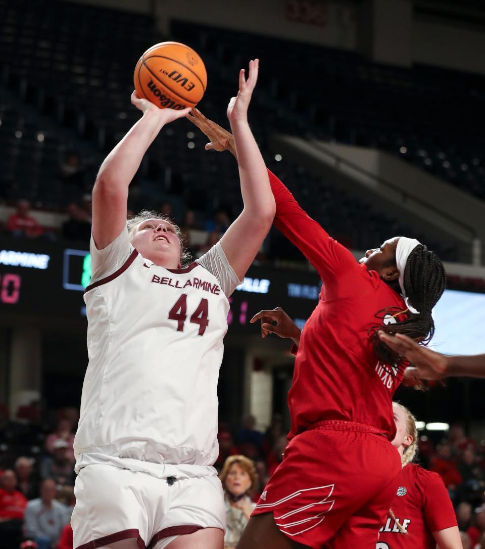 Bellarmine's Gracie Merkle (44) shot against U of L's Liz Dixon (22) during their game at Freedom Hall in Louisville, Ky. on Dec. 14, 2022.