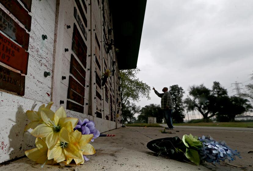 CARSON, ALIF. - JAN. 17, 2024. Compton resident Joe Rayford looks at a desecrated columbarium where his mother-in-law is entombed at Lincoln Memoriall Park Cemetery in Carson. The cemetery was recently targeted by thieves who took more than 100 name plaques from final resting places there, according to the Los Angeles County Sheriff's Department. (Luis Sinco / Los Angeles Times)