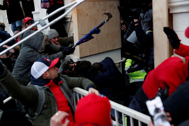 FILE PHOTO: Pro-Trump protesters clash with police during a rally to contest the certification of the 2020 U.S. presidential election results by the U.S. Congress, at the U.S. Capitol Building in Washington