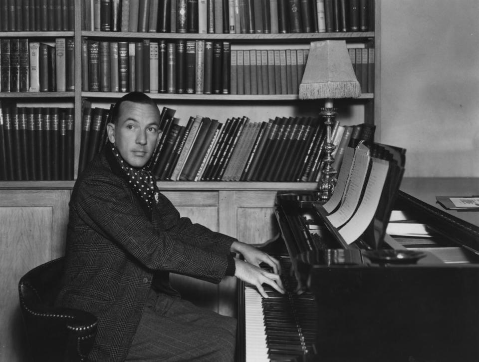 Coward, pictured playing the piano at home (Sasha/Hulton Archive/Getty Images)