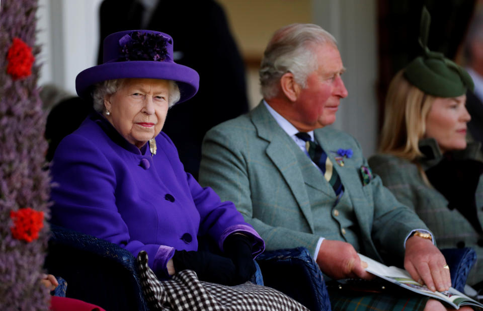 Britain's Queen Elizabeth and Prince Charles watch the proceedings at the annual Braemar Highland Gathering in Braemar, Scotland, Britain, September 7, 2019. REUTERS/Russell Cheyne