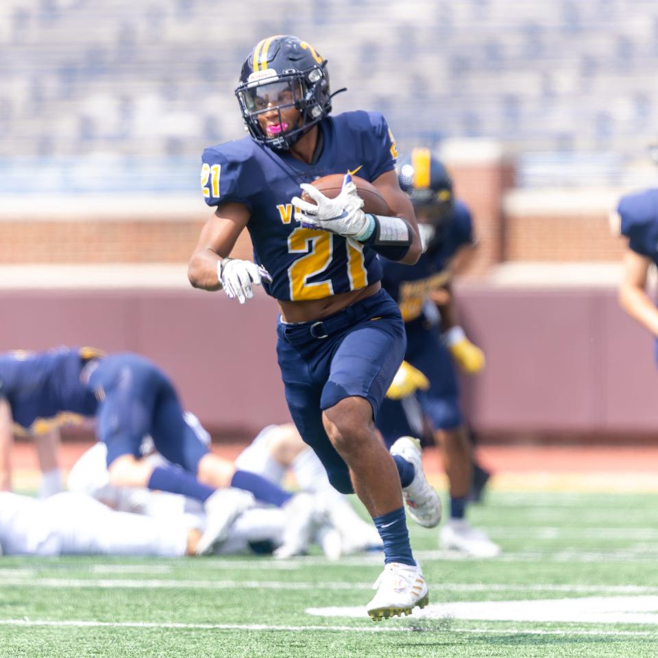 Haslett's Nakai Amachree takes the opening kickoff back for a touchdown in the Battle of the Big House match-up with Dewitt Thursday, Aug. 25, 2022 in Ann Arbor.