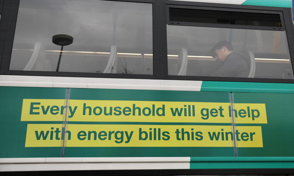A British government advert offering people help with winter energy bills is seen on the side of a bus in Stockport, Britain, November 16, 2022. REUTERS/Phil Noble