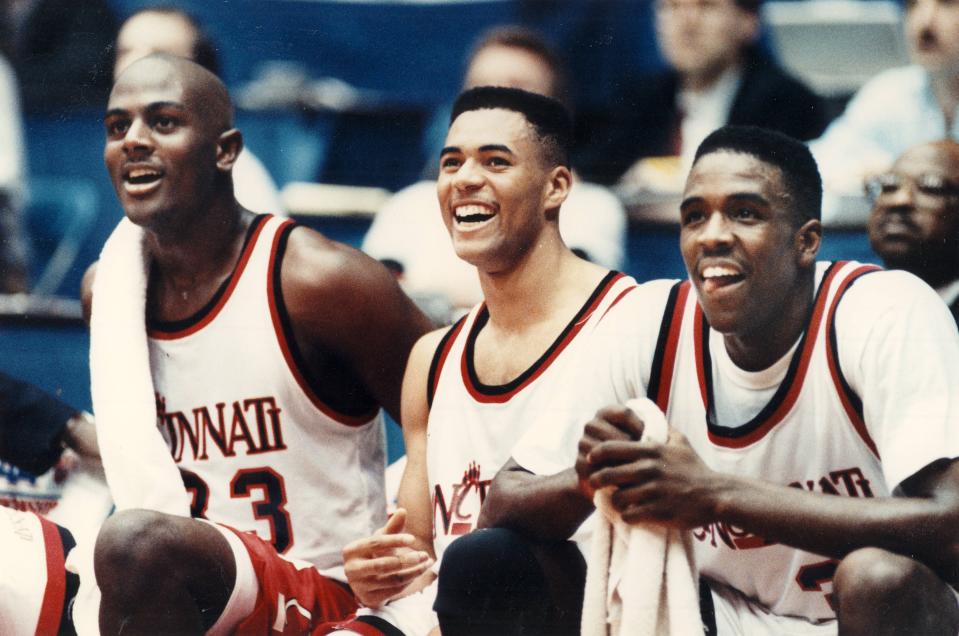 University of Cincinnati starters, from left, Terry Nelson, Anthony Buford and Herb Jones enjoy the last Bearcat basket during a game on March 20, 1992.