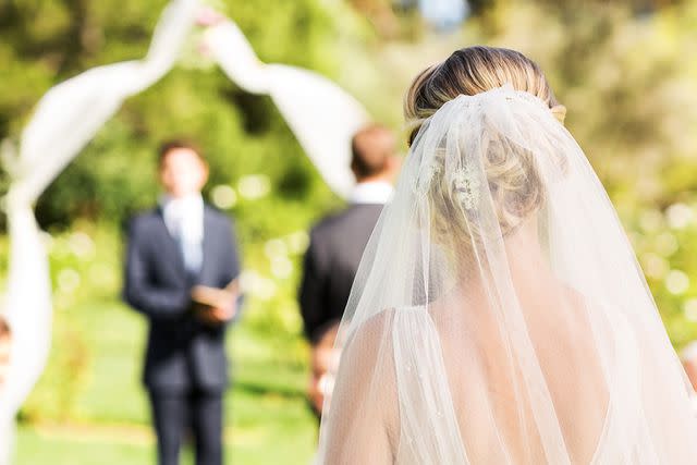 <p>Getty</p> Stock image of a bride walking down the aisle