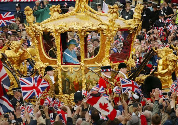 PHOTO: Britain's Queen Elizabeth and Prince Philip ride in the Golden State Carriage at the head of a parade from Buckingham Palace to St Paul's Cathedral celebrating the Queen's Golden Jubilee, on June 4, 2002, in London. (Sion Touhig/Getty Images, FILE)