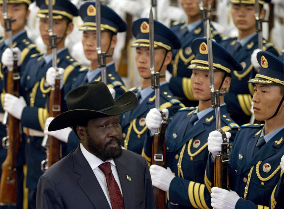 South Sudan's President Salva Kiir reviews an honor guard with Chinese President Hu Jintao, unseen, during a welcoming ceremony at the Great Hall of the People in Beijing, China, Tuesday, April 24, 2012. (AP Photo/Alexander F. Yuan)