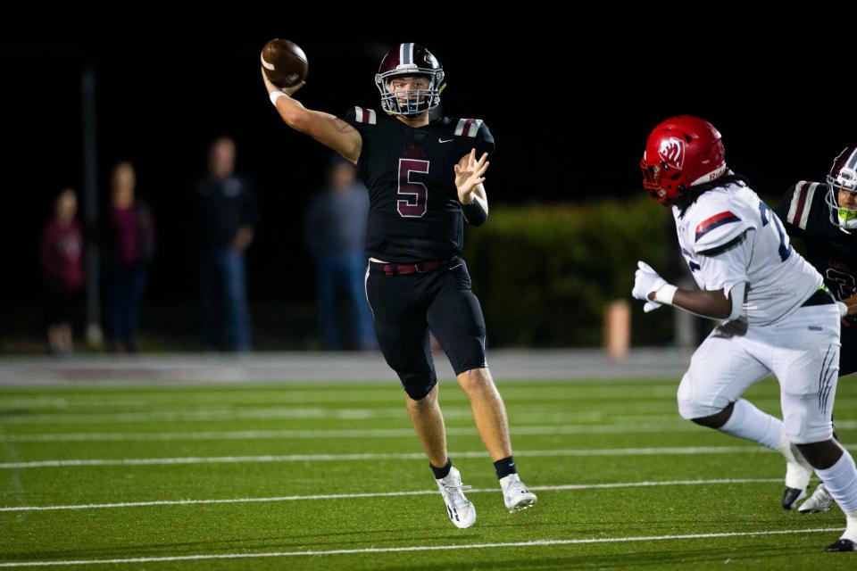 First Baptist Academy's Ty Keller (5) looks to throw the bal during the Class 2A football state semifinal between First Baptist Academy and Champagnat Catholic on Friday, Dec. 3, 2021 at First Baptist Academy in Naples, Fla. 