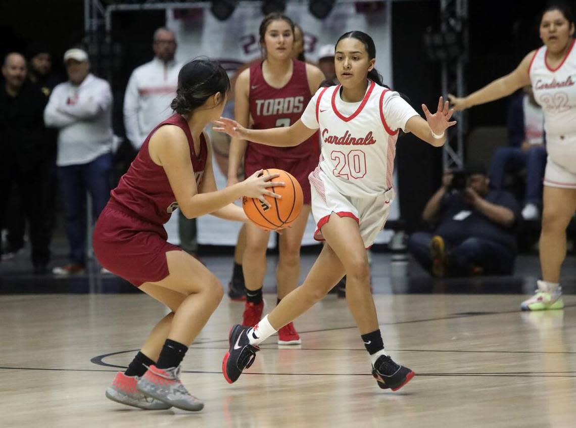 Matilda Torres High junior Sheng Lee runs into the defense of Lindsay High sophomore Melanie Millán during the CIF Central Section Division VI girls championship at Selland Arena on Feb. 24, 2023.