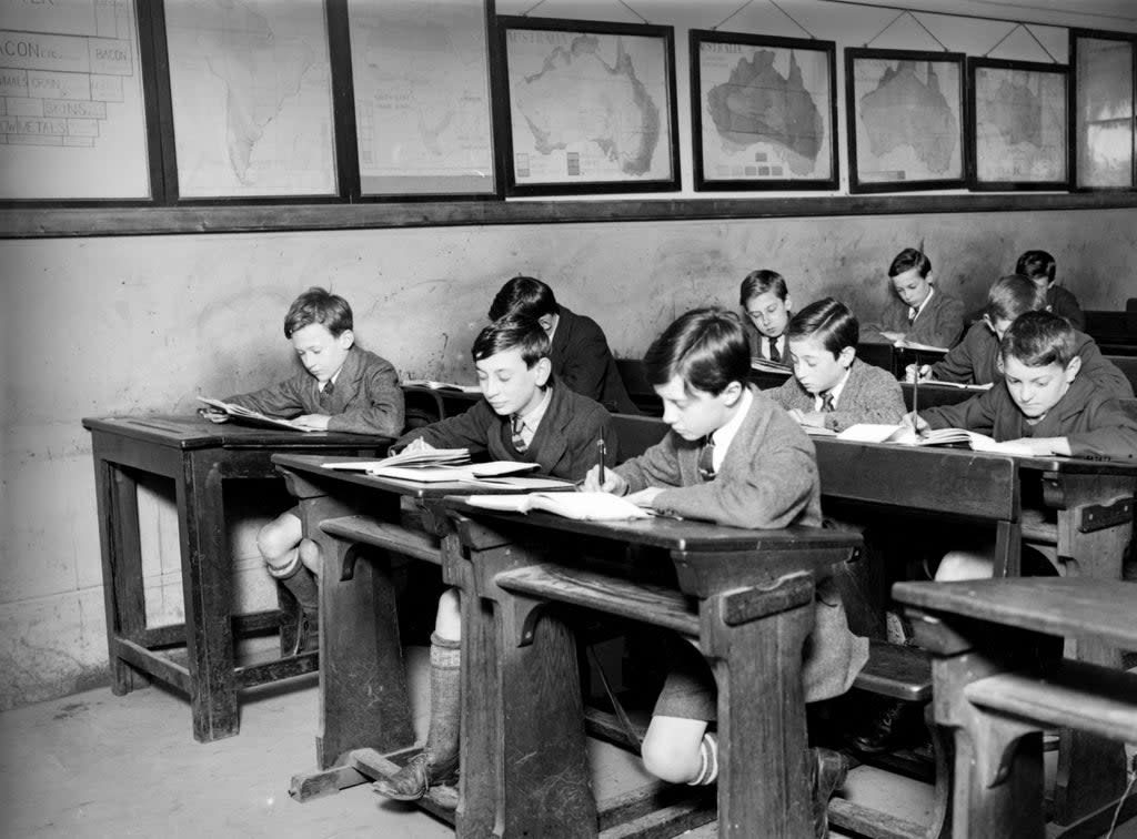 May 1922:  Boys at work in their classroom.  (Photo by Topical Press Agency/Getty Images) (Getty Images)