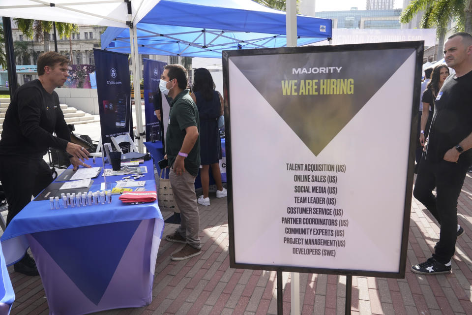 A signs seeking employees by the company Majority is displayed at the Venture Miami Tech Hiring Fair Thursday, April 14, 2022, in Miami. America’s employers added 428,000 jobs in April, extending a streak of solid hiring that has defied punishing inflation, chronic supply shortages, the Russian war against Ukraine and much higher borrowing costs. (AP Photo/Marta Lavandier)
