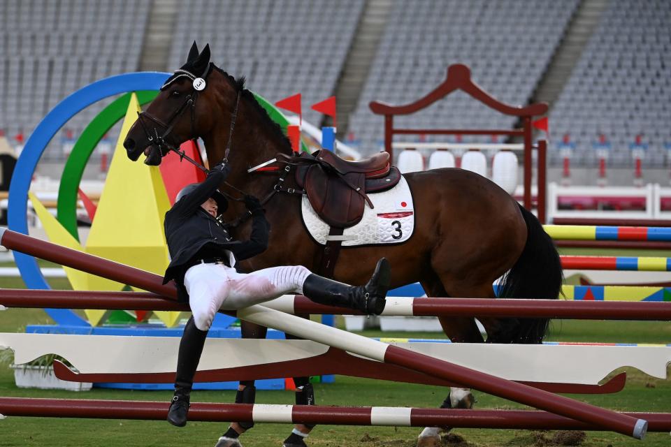 Annika Schleu from Germany falls after her horse refused to jump