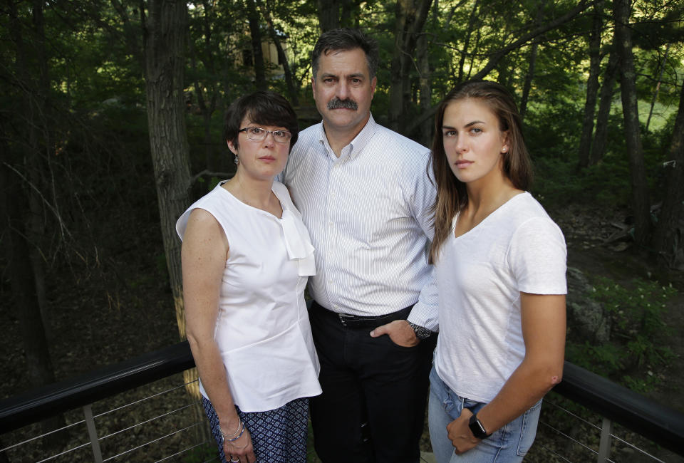 FILE - Family members of 18-year-old murder victim Andrew Oneschuk, from left, mother, Chris; father, Walter, and sister, Emily, stand for a portrait at their home on Aug. 9, 2017, in Wakefield, Mass. Devon Arthurs pleaded guilty Monday, May 8, 2023, to fatally shooting his two Florida roommates in 2017, including Oneschuk, abruptly avoiding the start of a murder trial in which he had planned to use the insanity defense, according to court records. (AP Photo/Steven Senne, File)